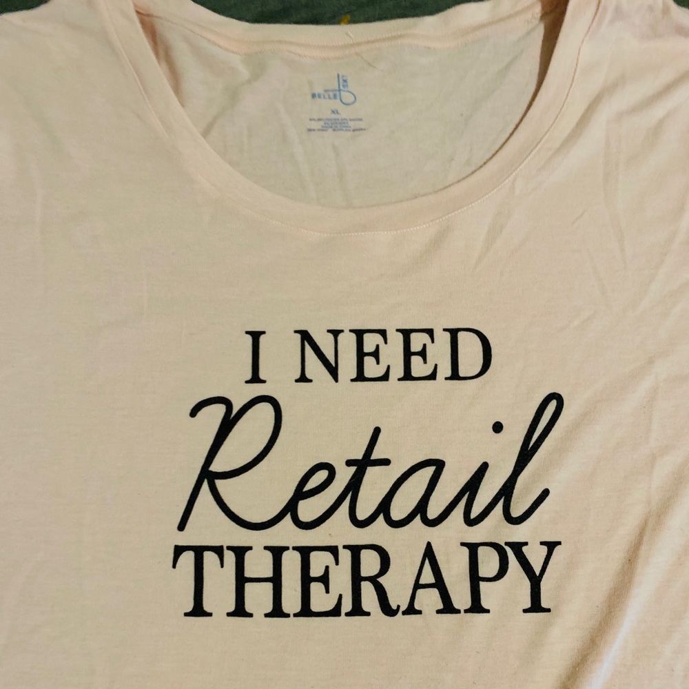 Women’s graphic tee says retail therapy size xl